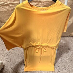 Yellow/Lemon color mini dress but with loose top and wide mid-arm sleeves